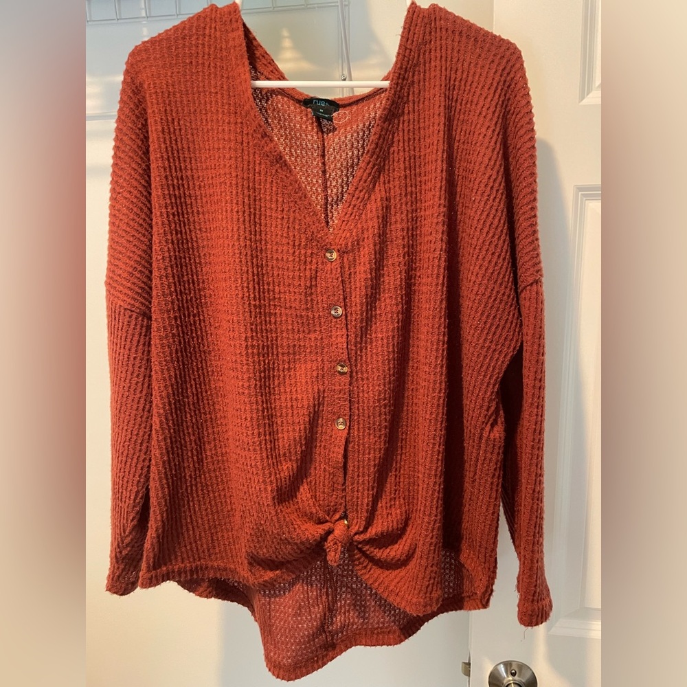 Rust colored waffle knit long sleeve tie front top. Size 1X.